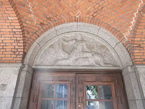 Relief above the main entrance in the arcade