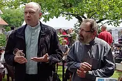 Czech Catholic priests wearing shirts with collars