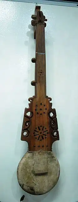 Pamiri rubab, longer necked type of rubab, sound holes up neck show it is hollow