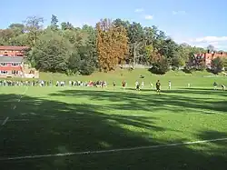 Rugby being played on Home in 2006 with Shirley Goss in the top right.