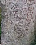 The head and tail of the serpent are bound to the stone.