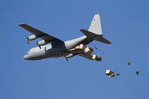C-130 Hercules conducting an airdrop demonstration.