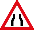 Roadway narrows from both sides ahead