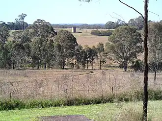 Training farm fields and early 1900s silo