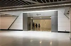 Entrance to the underground pedestrian linkway to MyTown Shopping Centre at the Upper Concourse Level of the station
