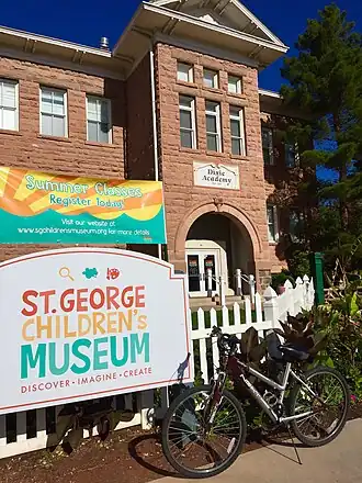 Red stone building with bicycles in front