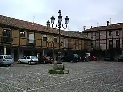 Cars parked in Saldaña's old town square, the Plaza Vieja. Cars will be forbidden in the square after a renovation that began in September, 2019 is completed.[8]