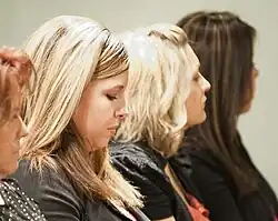 Image 27American women with popular early 2010s hairstyles, including chunky highlights, flat-ironed layers, and deep side parts with crown volume, 2012. (from 2010s in fashion)