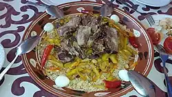 Plov (also pilaf, palov, osh) – a symbol of Uzbek cuisine, made with onion, carrot and rice; it can also include meat, boiled eggs, and qazi (sausage made of horse meat)