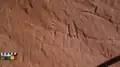 Side-by-side rock carvings