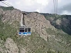 Cable cars pass mid-stream on the Sandia Peak Tramway in Albuquerque, New Mexico.