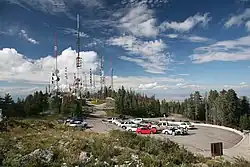 View of Sandia Crest with multiple radio, television and communication towers at its peak