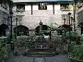 The courtyard and garden of the convent with a statue of St. Francis of Assisi in the middle