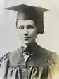 Woman in cap and gown graduation regalia