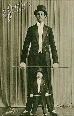 Nacken at age 17 as a circus acrobat with a young boy assistant