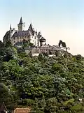 Image 2Coloured black and white photograph: the Burgberg with Wernigerode Castle (between 1890 and 1905) (from List of mountains and hills of the Harz)
