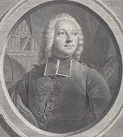 A man in clerical garb and a wig, looking to the left, with a curtain and a bookcase behind him.