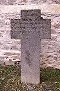 Inscription side of a basalt grave cross