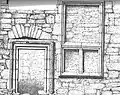 Window and armorial panelling over the entrance doorway