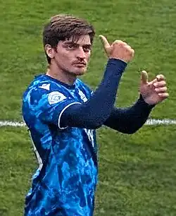 Man walking and giving the thumbs up