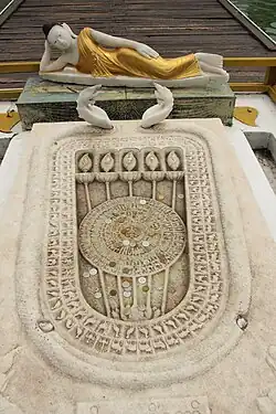 Buddha footprint at temple entrance