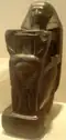 A kneeling statue of Senenmut, now in the Metropolitan Museum.