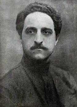 Photograph of a black and white document with handwriting on it