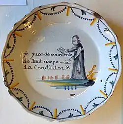 A priest swears "with all my power" to maintain the Constitution; the clergy were made to so swear ("je jure de maintenir de tout mon pouvoir la constitution") in November 1790