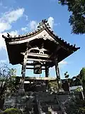 Shōrō next to the entrance of Enkōji