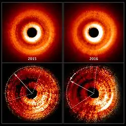 Shadow moving counterclockwise around a gas and dust disc.[26]