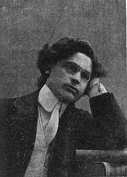 Shahan Natalie, Armenian activist and writer, seated with his hand resting on his face.