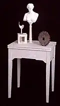 "Inevitability of Longing": paper collage, plaster, wood, glass. 53 x 23 1/4 x 12 inches. 1994.