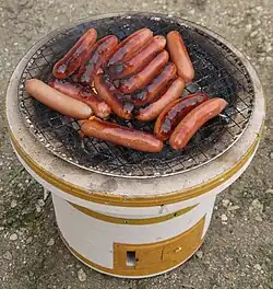 Grilling sausages