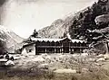 Wilson Cottage bungalow in Harsil, c. 1860. Wilson is seated to the left with his brother-in-law Mungetu Chand.