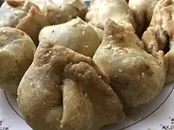 Shingara, meaning water caltrop, is the Bengali name for samosas, fried triangular pastry snacks.[38]