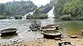 Bharachukki Falls is where tourists can access the waterfall basin. The circular thing in the foreground is a boat.