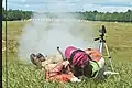 Competitor shooting at 1000 yards (914.4 meters) laying on back