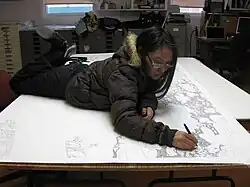 Shuvinai Ashoona working on a drawing