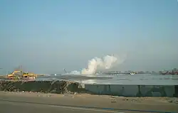 Gas plumes next to excavators working