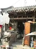 From the dusty, lackluster gate of a siheyuan on can still tell its past grandeur