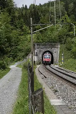 Photo of a Zurich S-Bahn train leaving a portal of the Zimmerberg Tunnel