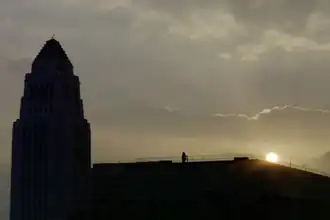 The silhouette of City Hall at sunrise