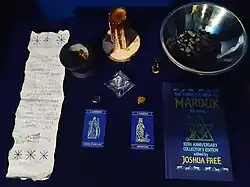 Altar belonging to a Canadian practitioner of Mardukite Zuism. On the cover of the Book of Marduk, there is a Zuist version of the merkabah ("chariot") , the means of connection with the seven Anunnaki and the supreme trinity (An, Enlil, Enki).[21]