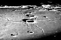 Oblique view at low sun angle from Apollo 8, and one of the lunar domes is at right