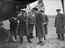 Royal Air Force officers in greatcoats inspecting a Fairey Battle in France, 1939