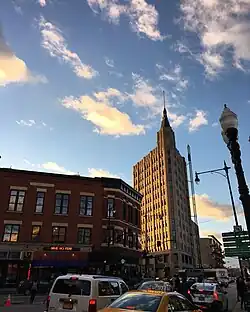 Sunset lighting wispy clouds above the Robey Hotel
