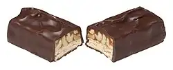 A Snickers chocolate bar covered in dark chocolate