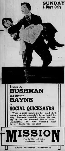 Old newspaper depicting a man holding a woman in his arms