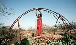 Image 20Somali woman building a Somali house (from Culture of Somalia)