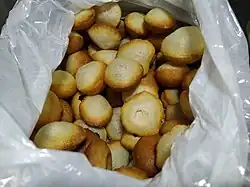 A pile of small puris with light, smooth appearance